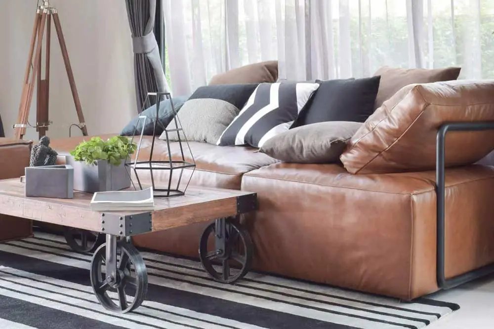 brown-leather-sofa-accessorised-with-cushions