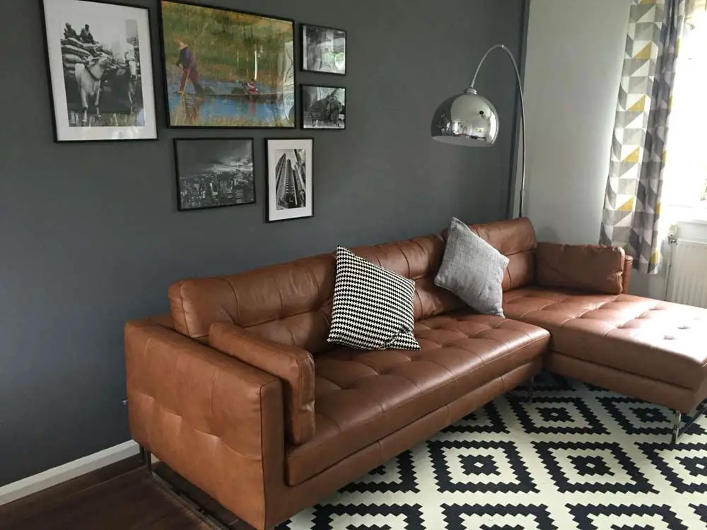brown-leather-sofa-grey-feature-wall