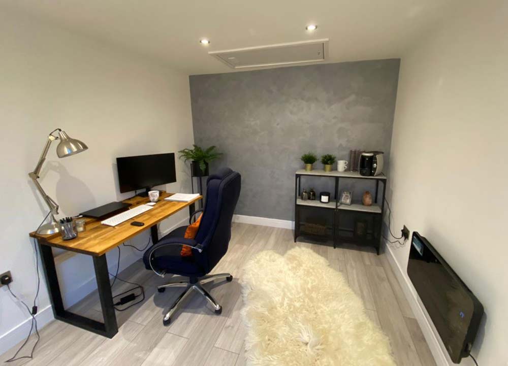 office garage conversion with rug and heater