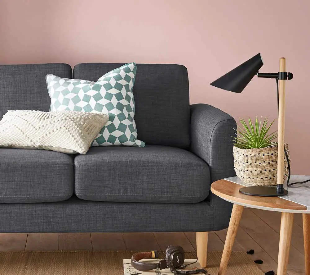 soft-pink-wall-with-dark-grey-sofa