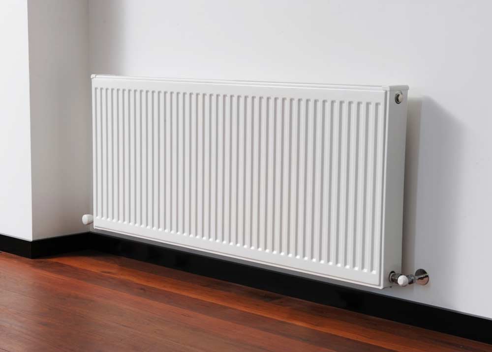 white radiator on wall